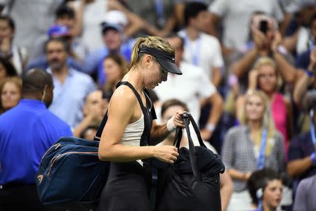 Sep 3, 2018; New York, NY, USA; Maria Sharapova of Russia walks off the court after losing to Carla Suarez Navarro of Spain in a fourth round match on day eight of the 2018 U.S. Open tennis tournament at USTA Billie Jean King National Tennis Center. Mandatory Credit: Danielle Parhizkaran-USA TODAY Sports - 11185262