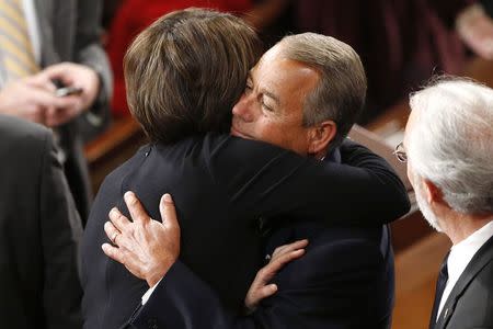 U.S. House Speaker John Boehner (R-OH) hugs Representative Cathy McMorris Rodgers (R-WA) as he gathers with fellow members of Congress to elect the speaker on the first day of their new session at the U.S. Capitol in Washington January 6, 2015. REUTERS/Jonathan Ernst