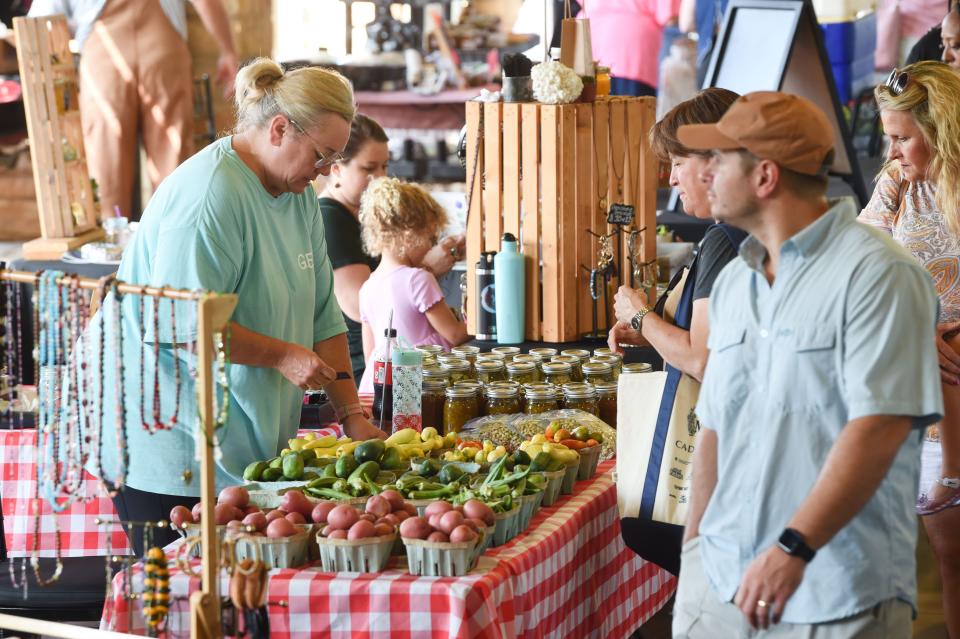 Aug 27, 2022; Tuscaloosa, AL, USA; Patrons shop at the Farmer's Market Saturday, Aug. 27, 2022, at the Tuscaloosa River Market. Mandatory Credit: Gary Cosby Jr.-Tuscaloosa News