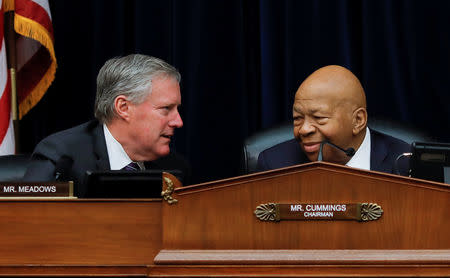 House Oversight and Reform Committee chairman Elijah Cummings (D-MD) confers with Ranking Member Rep Mark Meadows (R-NC) during a debate on the possibility of issuing a subpoena to a former White House security clearance chief on whistleblower allegations that career officials' decisions to deny security clearances to Donald Trump advisors were inappropriately reversed by Trump administration supervisors, as the committee meets on Capitol Hill in Washington, U.S., April 2, 2019. REUTERS/Carlos Barria