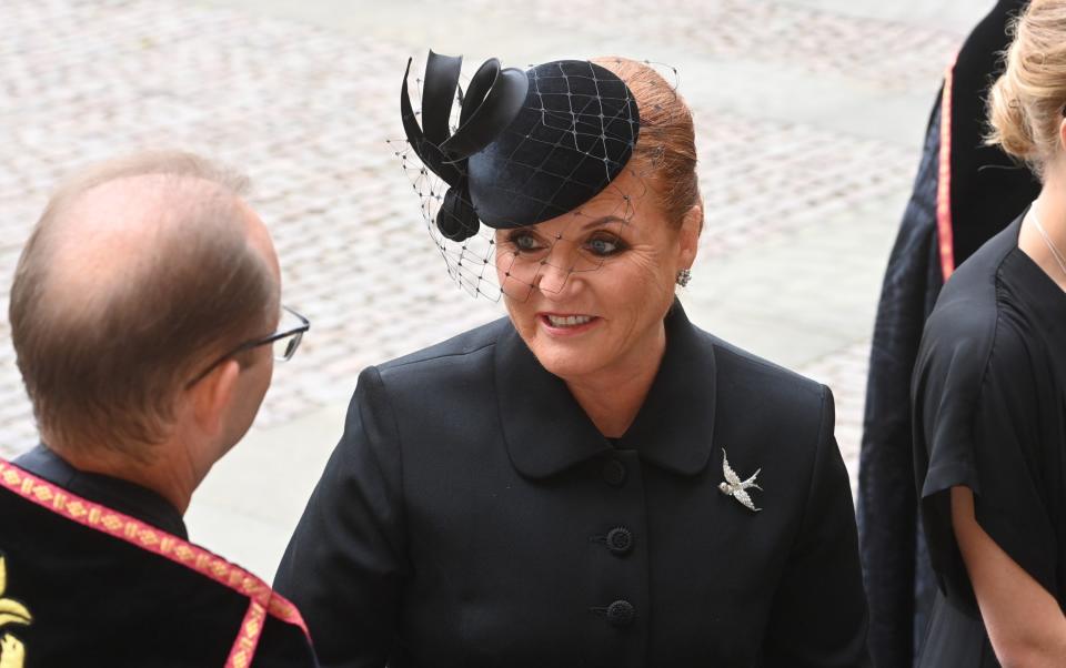 The Duchess was dressed all in black, with a net fascinator with a silver bird brooch and heels - Geoff Pugh for The Telegraph 