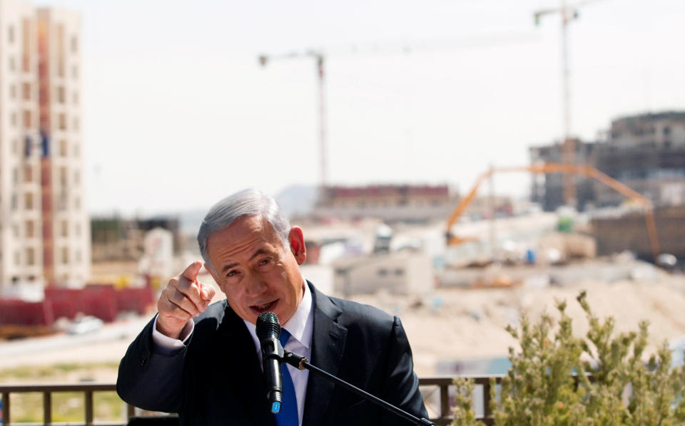 FILE PHOTO: Israeli Prime Minister Benjamin Netanyahu delivers a statement in front of new construction, in the Jewish settlement known to Israelis as Har Homa and to Palestinians as Jabal Abu Ghneim, in an area of the West Bank that Israel captured in a 1967 war and annexed to the city of Jerusalem, March 16, 2015. REUTERS/Ronen Zvulun/File Photo