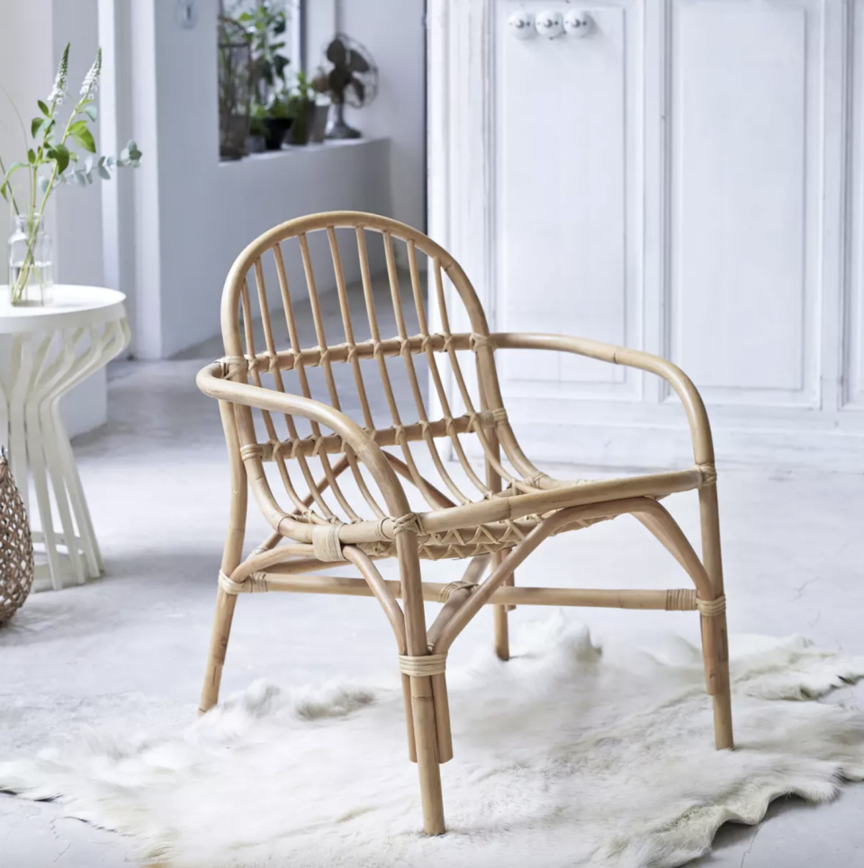 <strong>Under £150</strong><br><br>I don’t know whether it’s the influence of <em>Animal Crossing</em> but I’m very into rattan furniture and must have at least four of these chairs (with a matching table, of course).<br><br><strong>tikamoon</strong> Mina - Rattan Armchair, $, available at <a href="https://www.tikamoon.co.uk/art-mina-rattan-armchair-2015.htm" rel="nofollow noopener" target="_blank" data-ylk="slk:tikamoon" class="link ">tikamoon</a>
