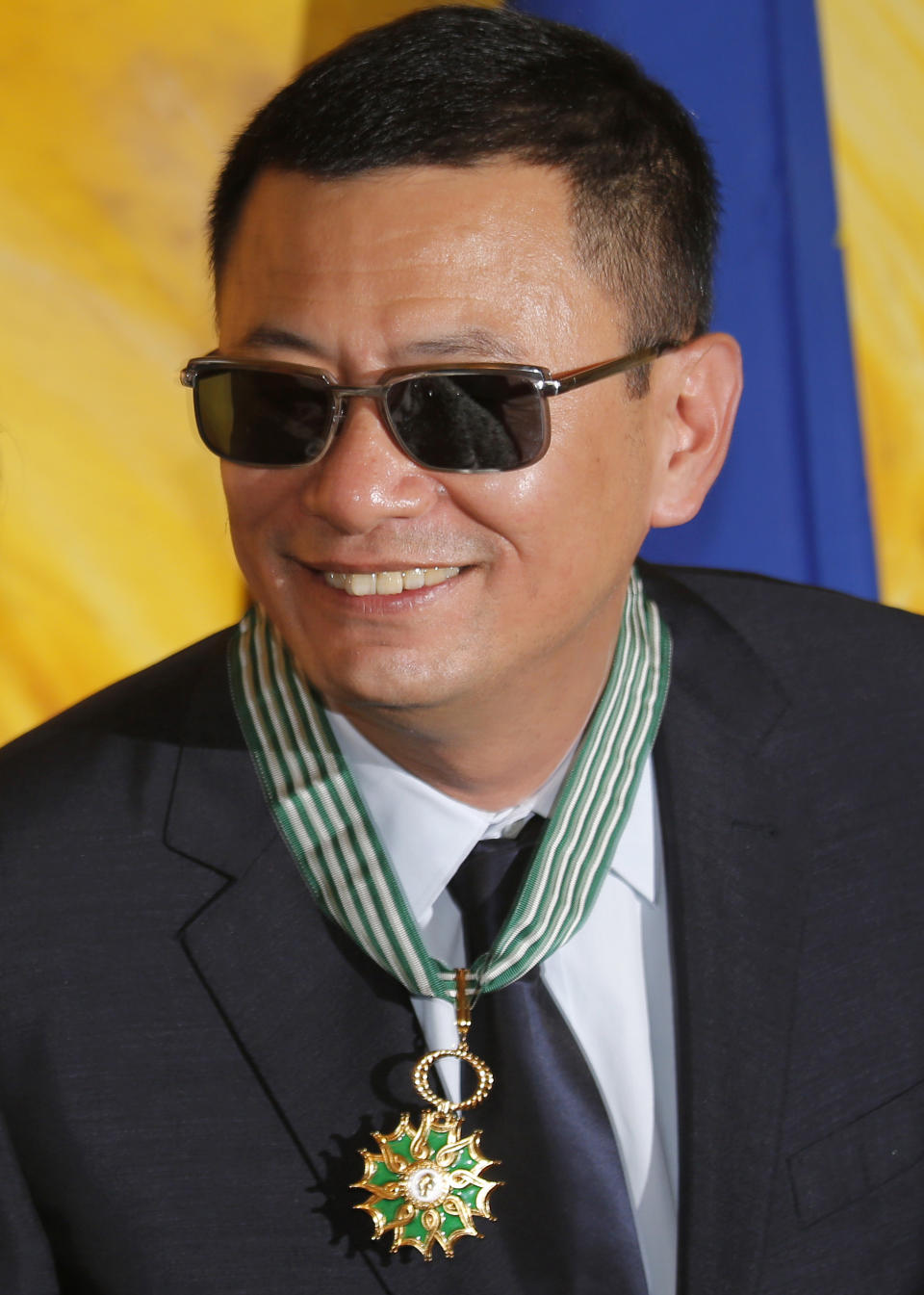 Hong Kong director Wong Kar-wai smiles after he received the Commandeur des Arts et Lettres from French Foreign Minister Laurent Fabius, in Hong Kong Sunday, May 5, 2013. Wong has been given France's highest cultural honor. (AP Photo/Vincent Yu)