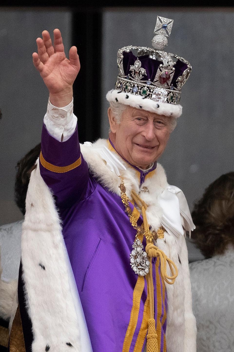 King Charles III waves from the Buckingham Palace balcony after the Coronation service of King Charles III and Queen Camilla on May 06, 2023