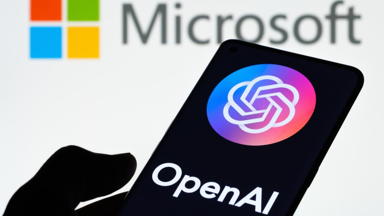  Microsoft Logo with Open AI logo on phone. 