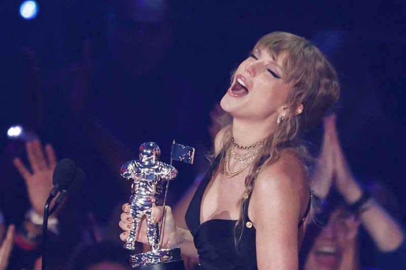 Taylor Swift, holding one of her 9 VMA Awards, stars in "The Eras Tour" concert film. File Photo by John Angelillo/UPI