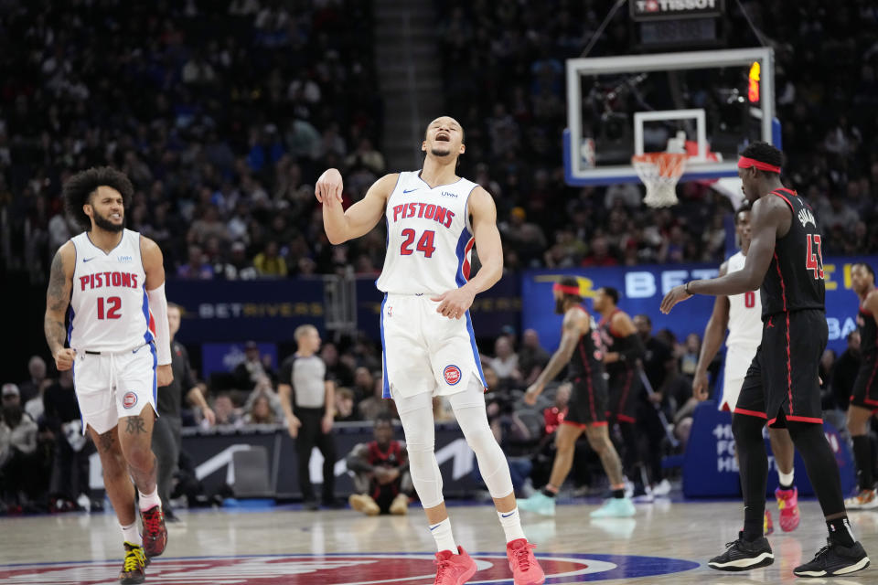 Detroit Pistons forward Kevin Knox II (24) reacts after a three-point basket during the first half of an NBA basketball game against the Toronto Raptors, Saturday, Dec. 30, 2023 in Detroit. (AP Photo/Carlos Osorio)