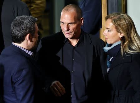 Greek economist Yanis Varoufakis (C) is seen outside the Syriza party headquarters in Athens, late January 25, 2015. REUTERS/Alkis Konstantinidis