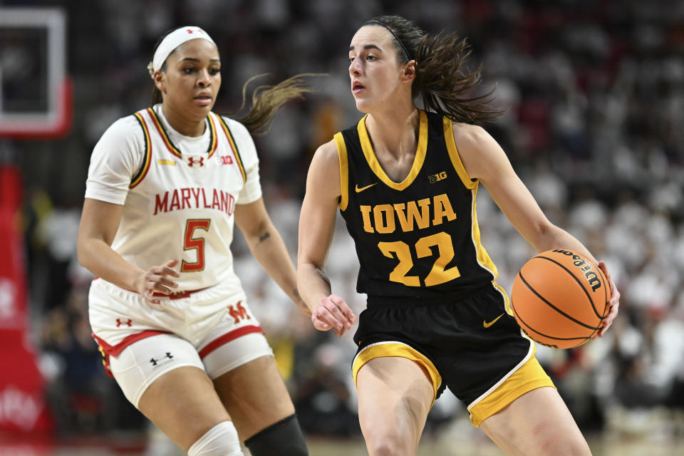 Feb 3, 2024; College Park, Maryland, USA; Iowa Hawkeyes guard Caitlin Clark (22) looks to pass as Maryland Terrapins guard Brinae Alexander (5) defends during the fist half  at Xfinity Center. Mandatory Credit: Tommy Gilligan-USA TODAY Sports