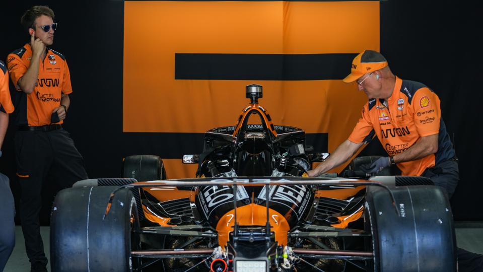 Arrow McLaren driver Pato O'Ward (5) engineers work on the car in the garage Saturday, May 18, 2024, during qualifying for the 108th running of the Indianapolis 500 at Indianapolis Motor Speedway.