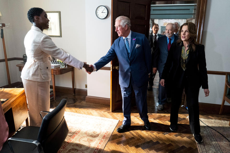 Britain's Prince Charles meets British actor Lashana Lynch as he tours the set of the 25th James Bond Film at Pinewood Studios in Iver Heath, Buckinghamshire, Britain June 20, 2019. Niklas Halle'n/Pool via REUTERS