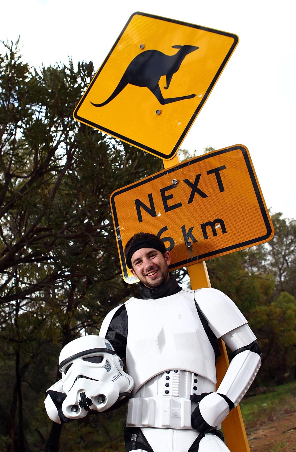 PERTH, AUSTRALIA - JULY 15: Stormtrooper Paul French is pictured on day 5 of his over 4,000 kilometre journey from Perth to Sydney taking a rest break on Old Mandurah Road on July 15, 2011 in Perth, Australia. French aims to walk 35-40 kilometres a day, 5 days a week, in full Stormtrooper costume until he reaches Sydney. French is walking to raise money for the Starlight Foundation - an organisation that aims to brighten the lives of ill and hostpitalised children in Australia. (Photo by Paul Kane/Getty Images)
