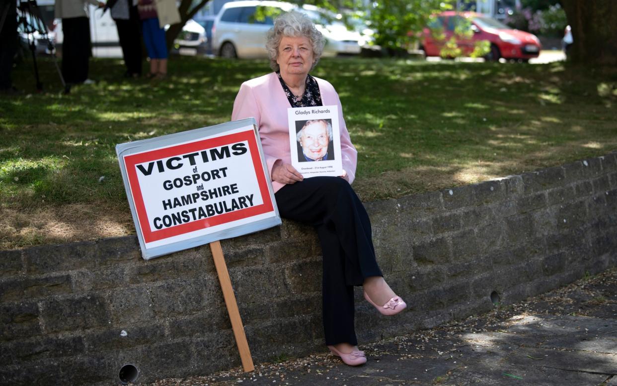 Gillian McKenzie, who fought to discover the truth about Gosport War Memorial Hospital, at the launch of the inquiry report. She is pictured holding a picture of her mother Gladys Richards, who died at the troubled institution - Christopher Pledger