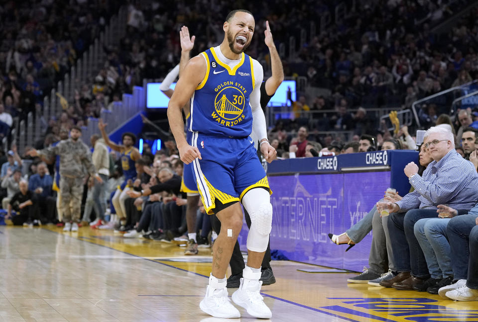 SAN FRANCISCO, CALIFORNIA - JANUARY 27: Stephen Curry #30 of the Golden State Warriors reacts towards the Toronto Raptors bench after he made a three-point shot during the third quarter at Chase Center on January 27, 2023 in San Francisco, California. NOTE TO USER: User expressly acknowledges and agrees that, by downloading and or using this photograph, User is consenting to the terms and conditions of the Getty Images License Agreement. (Photo by Thearon W. Henderson/Getty Images)