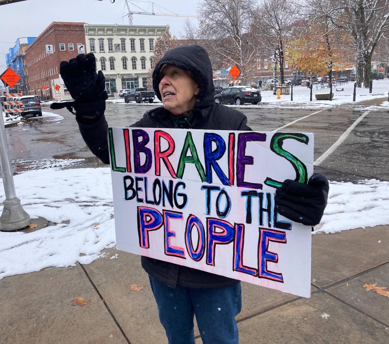 Doris Cipolla, a retired Erie public school teacher, is shown protesting Gannon's decision to rent space in Blasco Library at the corner of Peach and 6th streets on Nov. 27, 2023.