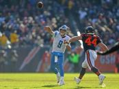 Nov 19, 2017; Chicago, IL, USA; Detroit Lions quarterback Matthew Stafford (9) throws a pass with Chicago Bears inside linebacker Nick Kwiatkoski (44) pressuring during the second quarter at Soldier Field. Mandatory Credit: Dennis Wierzbicki-USA TODAY Sports