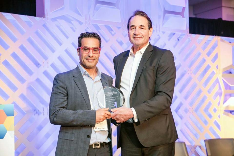 Charbel Makhoul, GM, VP of product, data science and analysis, Video, accepts the Advanced Advertising Innovation Award for Inscape from B+C senior content producer-business Jon Lafayette.