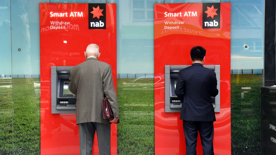 NAB customers using ATMs.