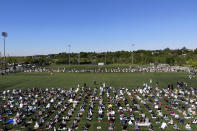 More than 2000 people participate in Eid al-Fitr prayers in Overpeck County Park in Ridgefield Park, N.J., Thursday, May 13, 2021. Millions of Muslims across the world are marking a muted and gloomy holiday of Eid al-Fitr, the end of the fasting month of Ramadan - a usually joyous three-day celebration that has been significantly toned down as coronavirus cases soar. (AP Photo/Seth Wenig)