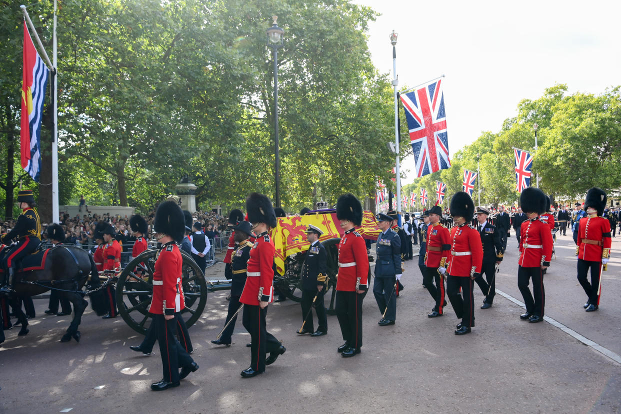 LONDON, ENGLAND - SEPTEMBER 14: The coffin carrying Queen Elizabeth II makes its way along Horse Guards Road North side during the procession for the Lying-in State of Queen Elizabeth II on September 14, 2022 in London, England. Queen Elizabeth II's coffin is taken in procession on a Gun Carriage of The King's Troop Royal Horse Artillery from Buckingham Palace to Westminster Hall where she will lay in state until the early morning of her funeral. Queen Elizabeth II died at Balmoral Castle in Scotland on September 8, 2022, and is succeeded by her eldest son, King Charles III.  (Photo by Shaun Botterill/Getty Images)