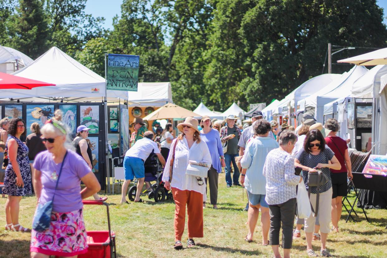 Visitors to the Salem Art Fair & Festival on July 21, without the benefit of the shady oak grove.