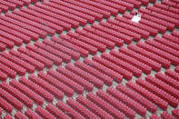 General view as a pair of fans sit in a large section of empty seats during a rain delay prior to the game between the St. Louis Cardinals and Cincinnati Reds at Great American Ball Park on April 15, 2018 in Cincinnati, Ohio. (Photo by Joe Robbins/Getty Images)