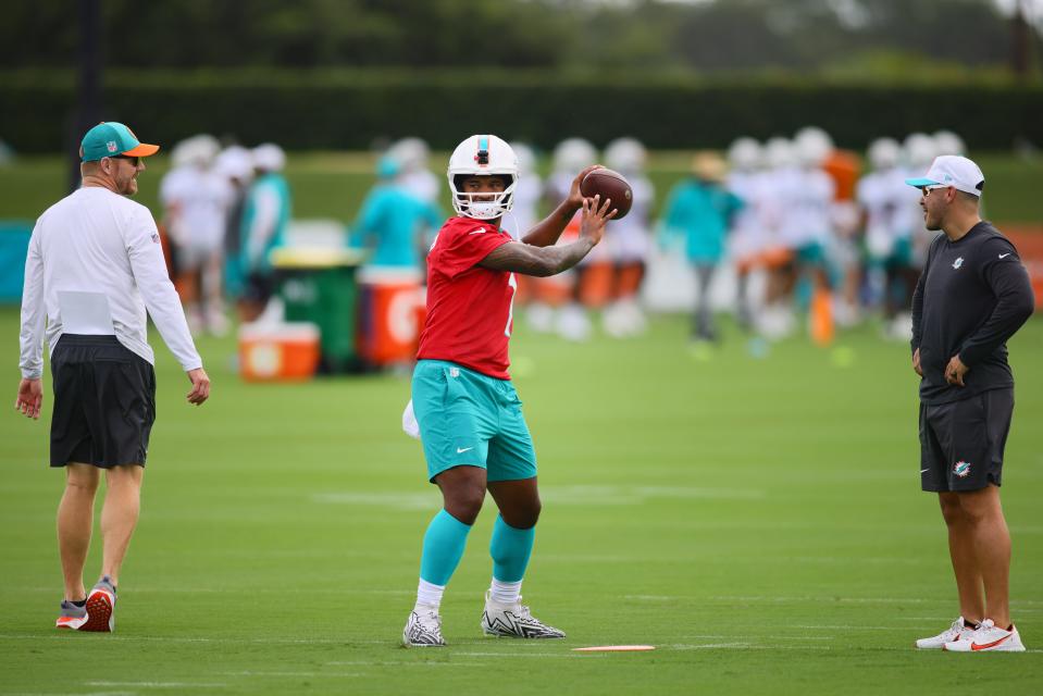 Jul 24, 2024; Miami Gardens, FL, USA; Miami Dolphins quarterback Tua Tagovailoa (1) throws the football during training camp at Baptist Health Training Complex. Mandatory Credit: Sam Navarro-USA TODAY Sports