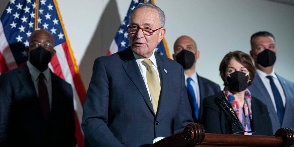 Senate Majority Leader Chuck Schumer, D-N.Y., speaks to reporters alongside, from left, Sen. Raphael Warnock, D-Ga., Sen. Cory Booker, D-N.J., Sen. Amy Klobuchar, D-Minn., and Sen. Alex Padilla, D-Calif., during a press conference regarding the Democratic party's shift to focus on voting rights