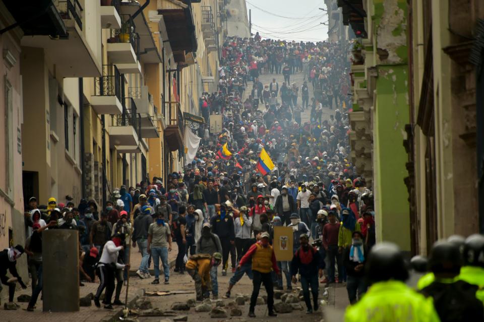 Demonstrators clash with riot police in Quito, as thousands march against Ecuadorean President Lenin Moreno's decision to slash fuel subsidies, on Oct. 9, 2019. (Photo: Rodrigo Buendia/AFP via Getty Images)