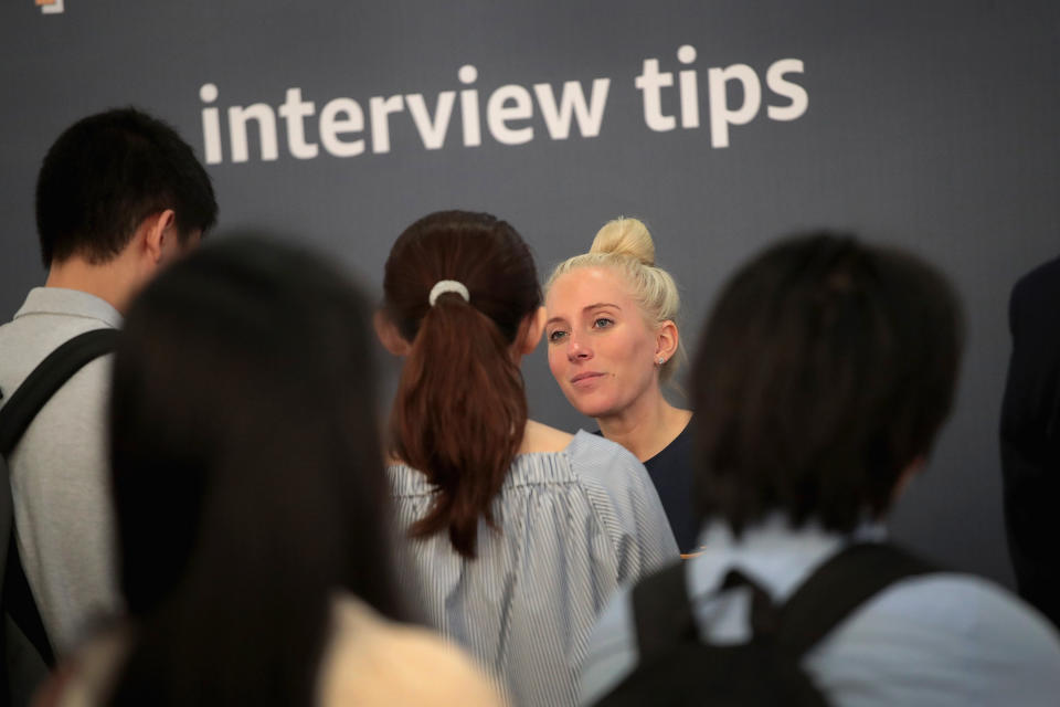 CHICAGO, ILLINOIS - SEPTEMBER 17: Job seekers are coached on interview practices with Amazon during a career fair held at Vertiport Chicago on September 17, 2019 in Chicago, Illinois. The event was one of several Amazon career fairs held across the country today as the company attempts to fill more than 30,000 full and part-time positions. (Photo by Scott Olson/Getty Images)