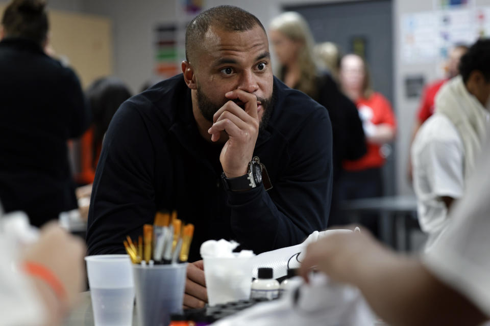 Dak Prescott won the NFL's Walter Payton Man of the Year award, then visited a local Boys & Girls Club on Friday in Phoenix. (Adam Hunger/AP Images for NFL)