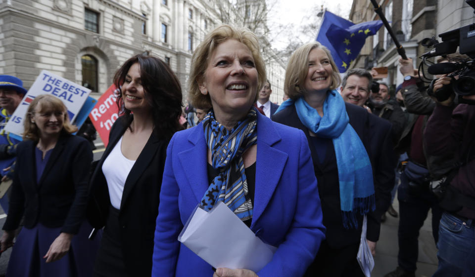 British politicians Anna Soubry, center, Heidi Allen, second left, and Sarah Wollaston, right, arrive for a press conference in Westminster in London, Wednesday, Feb. 20, 2019. Cracks in Britain's political party system yawned wider Wednesday, as three pro-European lawmakers - Soubry, Allen and Wollaston - quit the governing Conservatives to join a newly formed centrist group of independents who are opposed to the government's plan for Britain's departure from the European Union. (AP Photo/Kirsty Wigglesworth)