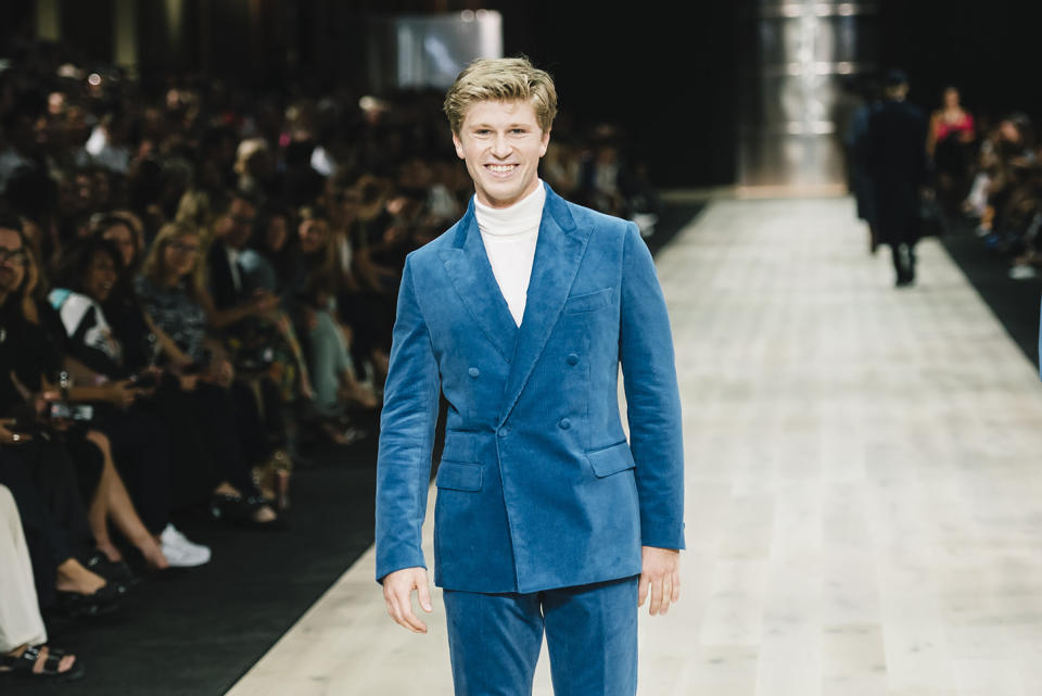 Robert Irwin in a blue suit on the catwalk