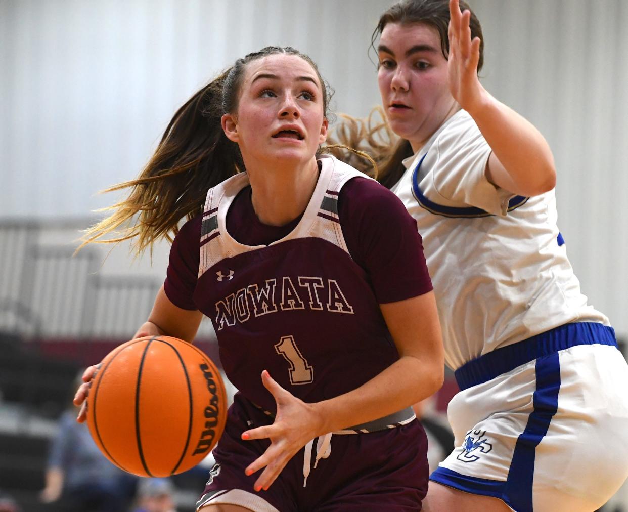 Nowata High School's Jordyn Ashley (1) drives the ball during basketball action at the Ty Hewitt Memorial Tournament in Nowata on Dec. 4, 2023. The Lady Ironmen defeated Rejoice Christian 44-38.