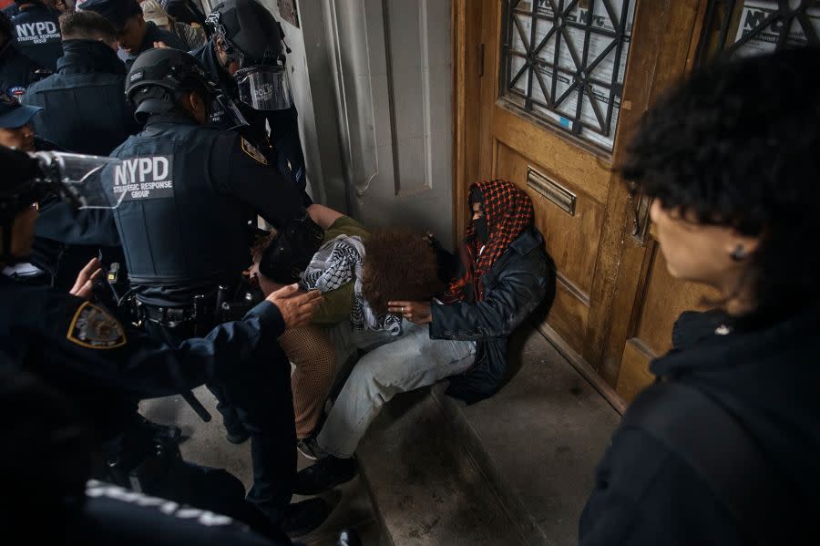 Police detain pro-Palestinian protesters near the Metropolitan Museum of Art, where the Met Gala takes place, Monday, May 6, 2024, in New York. (AP Photo/Andres Kudacki)