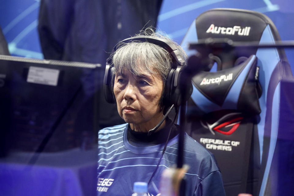 Chiang Yi-Shu watches the screen during the competition at Hungkuang University in Taichung, Taiwan on Saturday, Dec. 17, 2022.Chiang is one of the League of Legends players on Hungkung Evergreen Gaming's team, established this summer. The team, whose members range from 62 to 69 years old, was founded by Huang Jianji, the director of the department of Multimedia Game development and application of Hungkuang University. They competed in their first-ever video game tournament Saturday at the university. (AP photo/I-Hwa Cheng)