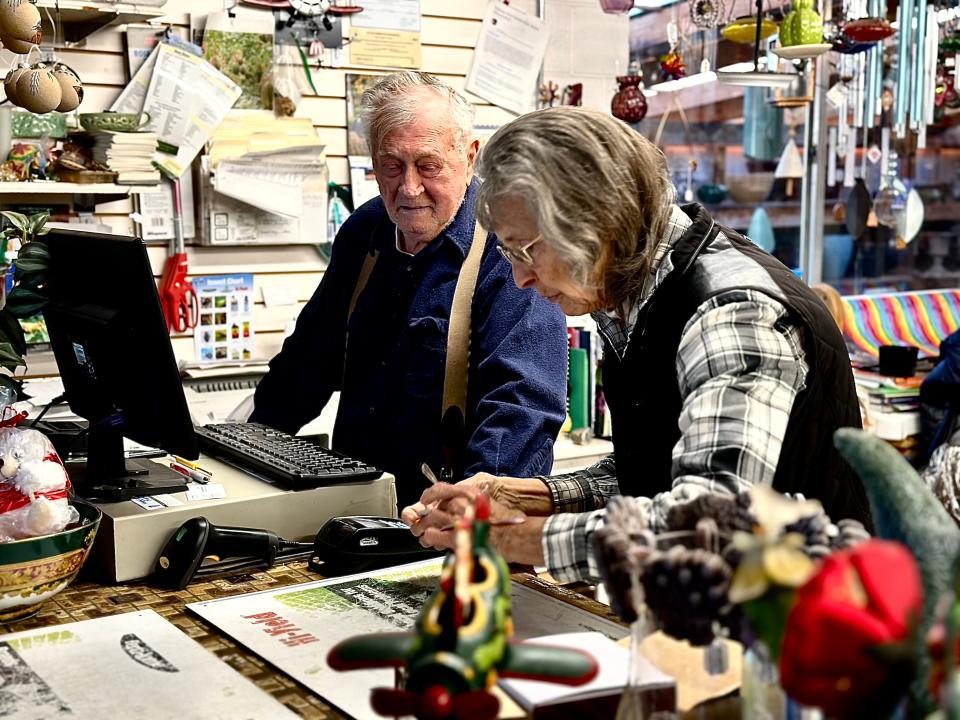 Willie and Debbie Kutac ring up a young customer near the end of the day  at Ku-Tips Nursery & Gift Shop on Nov. 25, and send her off with the number of candy canes approved by her mom.