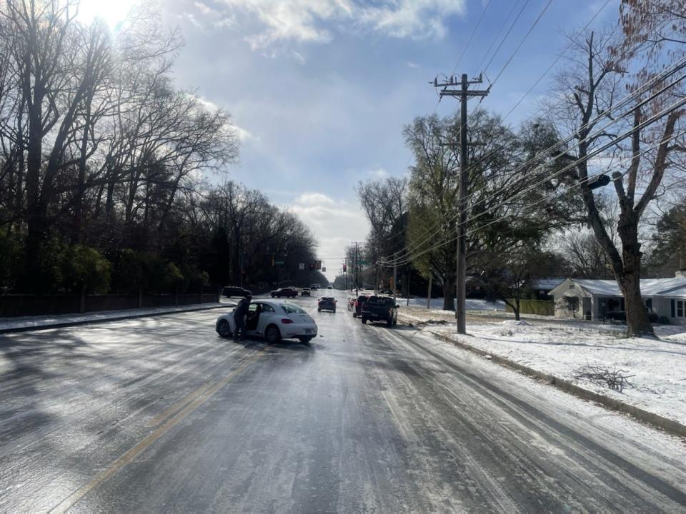 Cars slid on an ice-covered White Station Road near Walnut Grove Road on Friday, Dec. 23, 2022. Memphis roads were coated in snow and ice after a cold front dropped temperatures into single digits.
