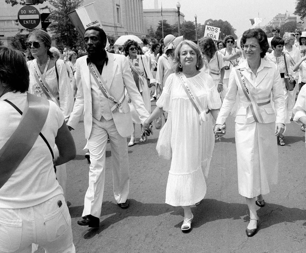 Leading supporters of the Equal Rights Amendment march in Washington on Sunday, July 9, 1978. From left: Gloria Steinem, Dick Gregory, Betty Friedan and Rep. Elizabeth Holtzman, D-N.Y..