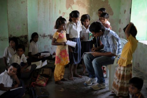 Girls are seen gathering around a male teacher at a small school in Dhanana, in the Rajasthan state district of Jaisalmer, which has one of the worst female sex ratios in India. Almost everyone in Devda and neighbouring villages acknowledges the reality of female infanticide, a crime based in ancient custom and continued today even as much of India experiences rapid economic and social change