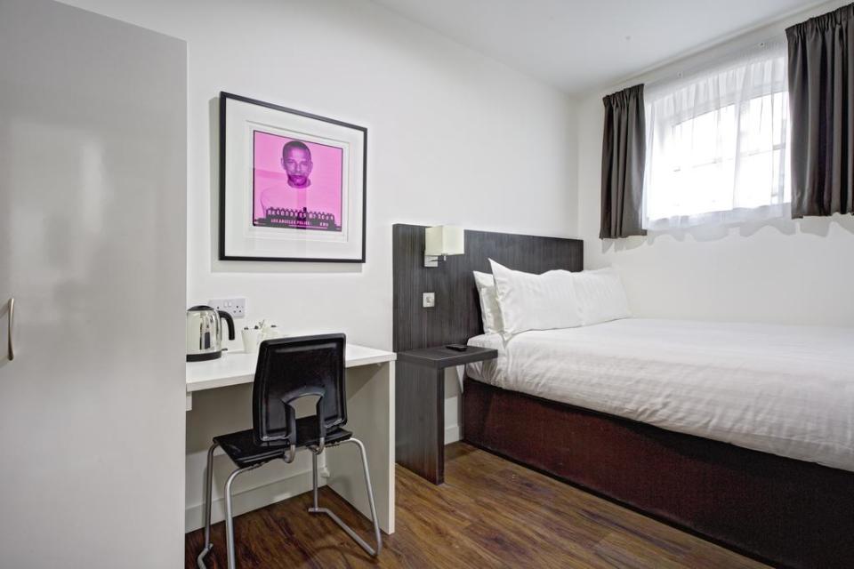 Each room features a photo of a former inmate. Photo: Booking.com