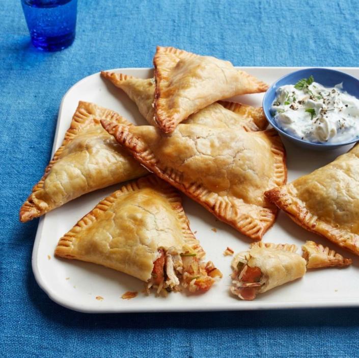 <p>Who says you have to save turkey for the main course? While it also tastes great as leftovers, if you're not cooking a whole turkey this year, these turnovers are a great way to still incorporate the bird into your meal. </p><p><strong><em><a href="https://www.womansday.com/food-recipes/food-drinks/recipes/a52072/turkey-turnovers-with-apricots-and-almonds/" rel="nofollow noopener" target="_blank" data-ylk="slk:Get the recipe for Turkey Turnovers with Apricots and Almonds.;elm:context_link;itc:0" class="link ">Get the recipe for Turkey Turnovers with Apricots and Almonds.</a></em></strong></p>