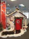 <p>This worker went all out - turning their cubicle into a Christmassy house complete with red front door.</p>