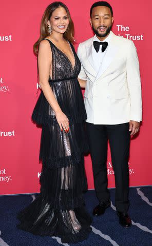 <p>Theo Wargo/Getty Images</p> Chrissy Teigen and John Legend at The King's Trust 2024 Global Gala.