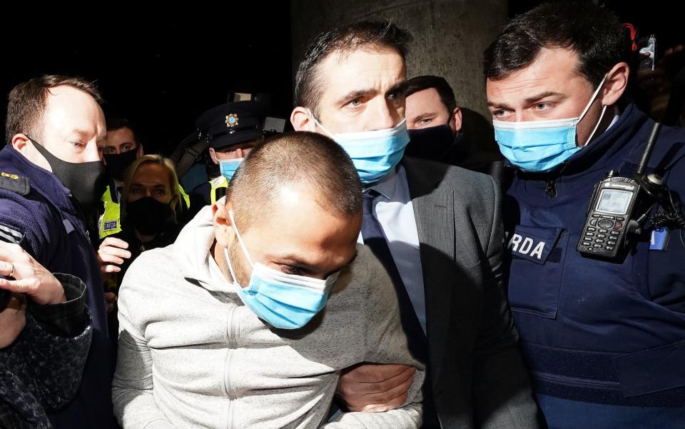 Jozef Puska (second left), 31, is led in to Tullamore District Court where he is charged with the murder of Irish teacher Ashling Murphy - Brian Lawless 