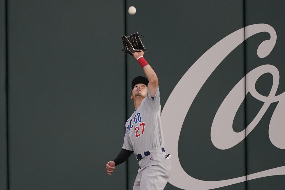 Chicago Cubs' Seiya Suzuki (27), of Japan, catches a fly ball hit by Atlanta Braves third baseman Austin Riley (27) in the eighth inning of a baseball game, Tuesday, April 26, 2022, in Atlanta. (AP Photo/Brynn Anderson)