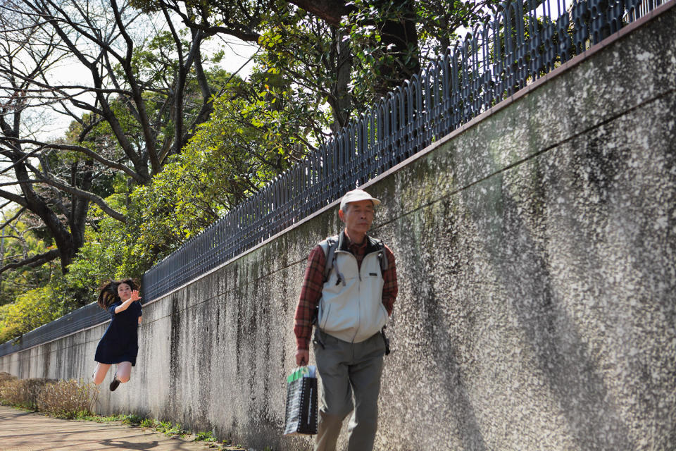 "I didn't plan to have this man in this shot," Hayashi said. "Then I noticed he had a bag from a famous camera store in Tokyo. As he passed by, I suddenly came up with an idea about 'levitating' towards him. "'Please show me what is inside your bag'' was the line I imagined." (Photo credit: Natsumi Hayashi/ yowayowacamera.com)