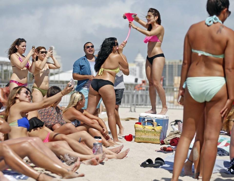 Spring break visitors gather on South Beach in 2015.