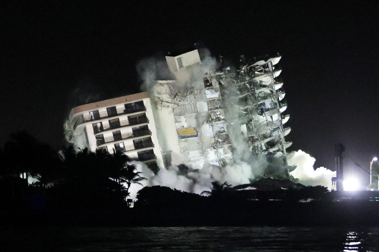 The remaining part of the partially collapsed 12-story Champlain Towers South condo building falls with a controlled demolition on July 4, 2021, in Surfside, Fla. (Joe Raedle / Getty Images)